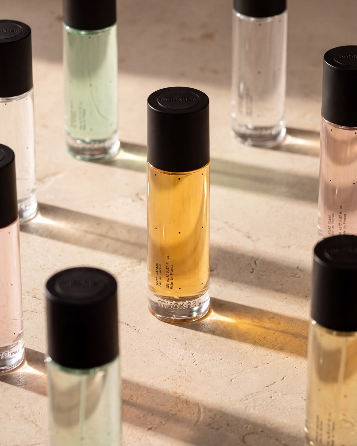 mubkhar Eaux de Parfum in a row, each a different colour
